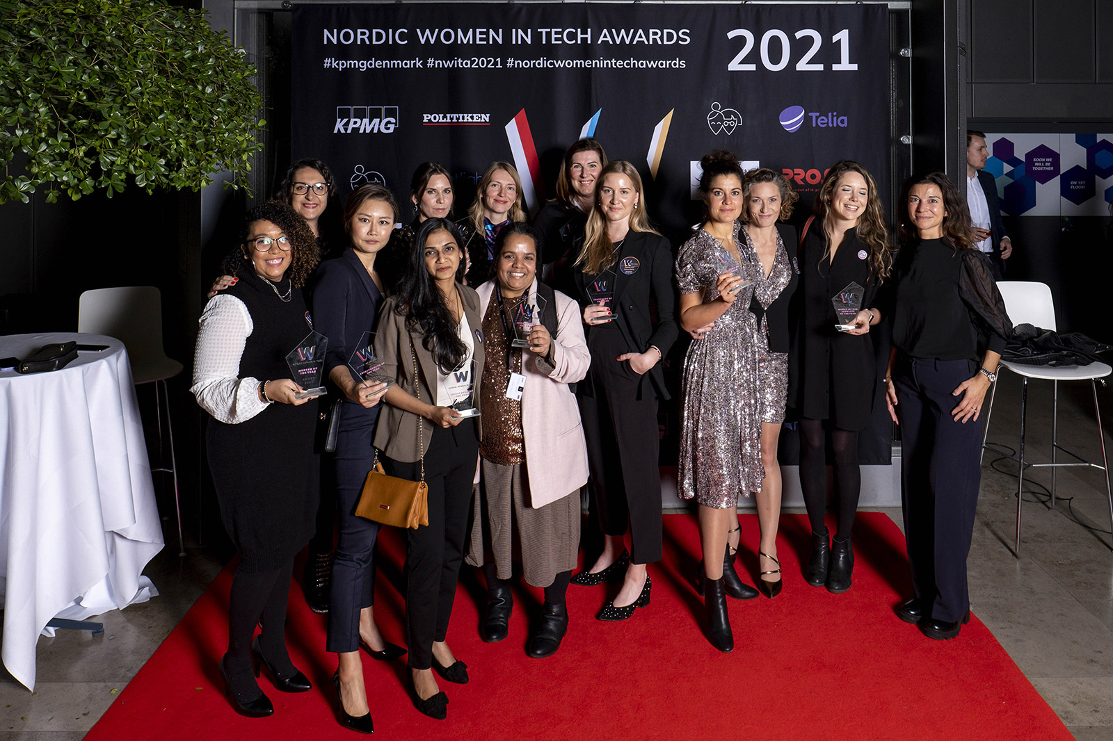 All winners from 2021 posing with their awards and the hosts